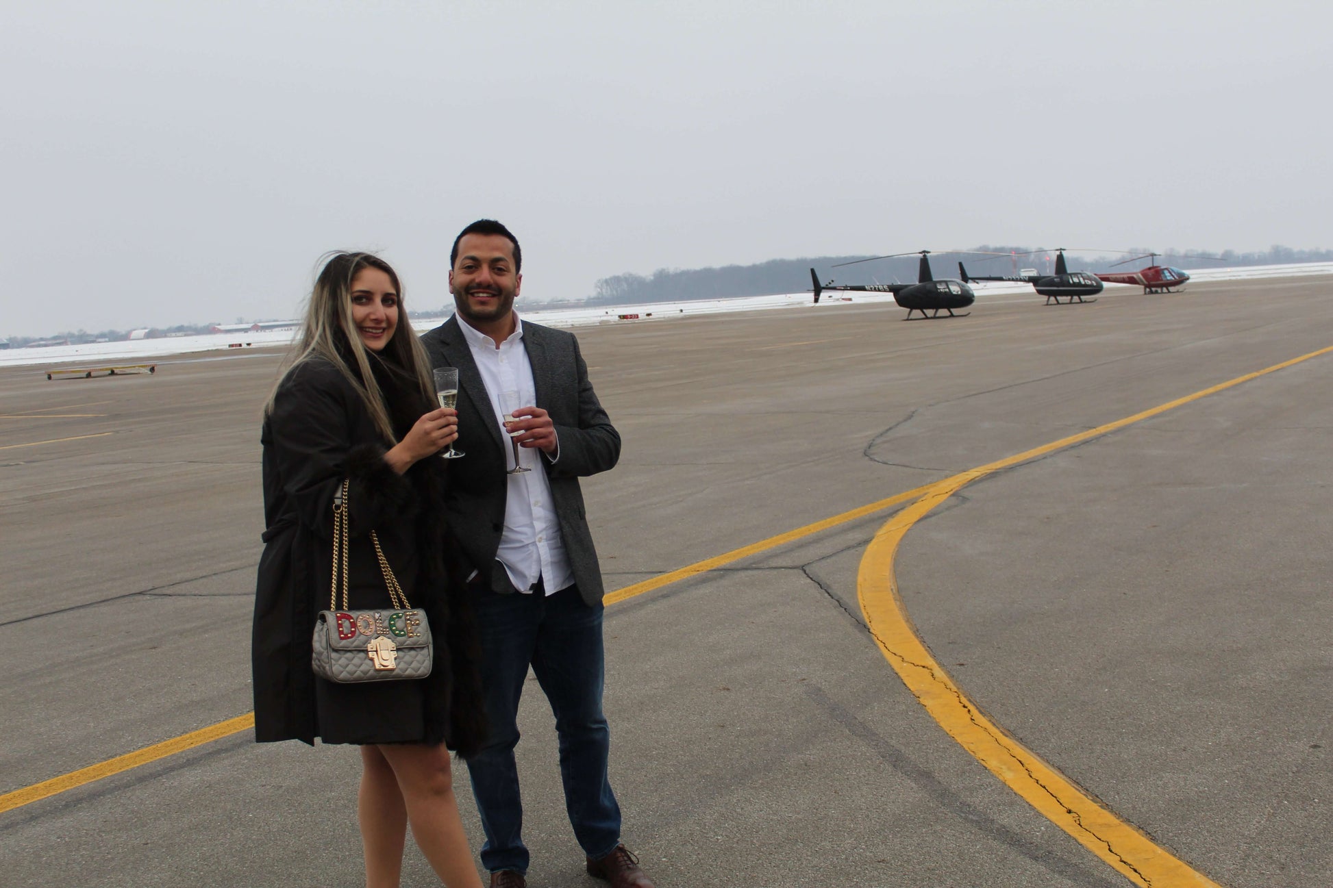 Couple Drinks Champagne after Helicopter Proposal Flight